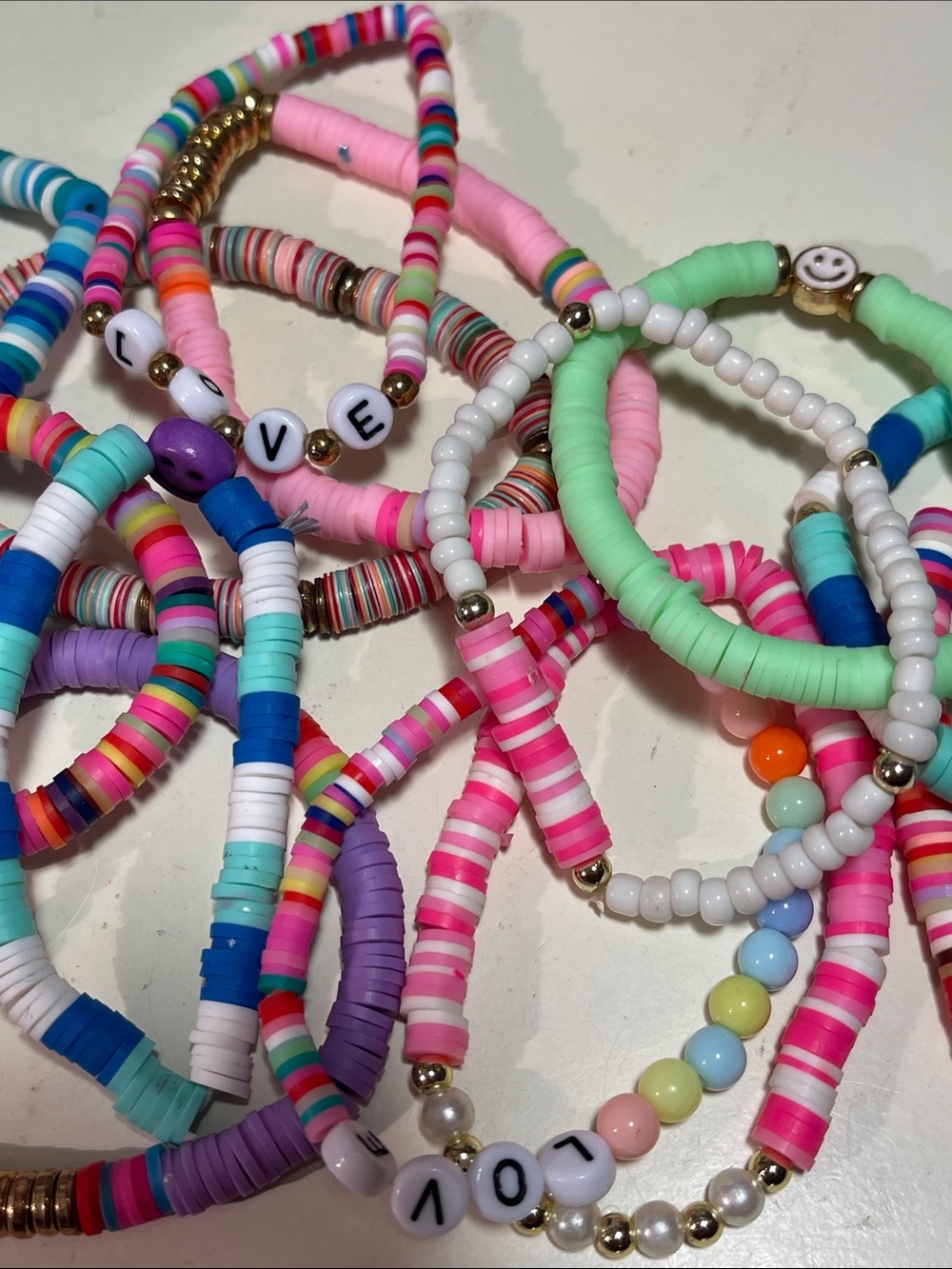 Bag of 14 colorful plastic bead stretch bracelets